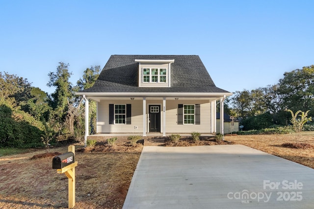 view of front of home featuring a porch and roof with shingles