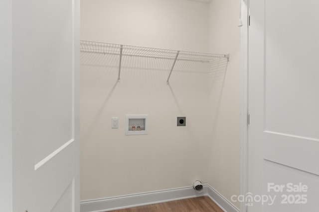 washroom with laundry area, baseboards, wood finished floors, washer hookup, and electric dryer hookup