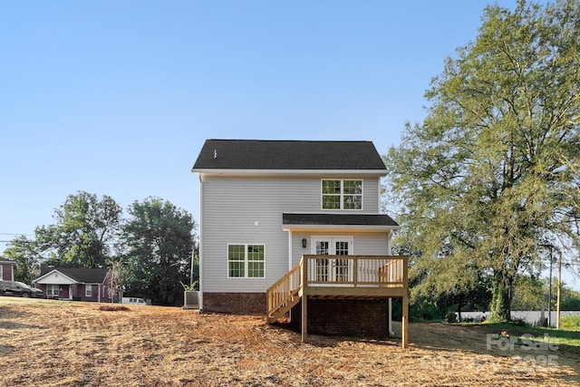 back of property featuring central AC, a deck, and stairs