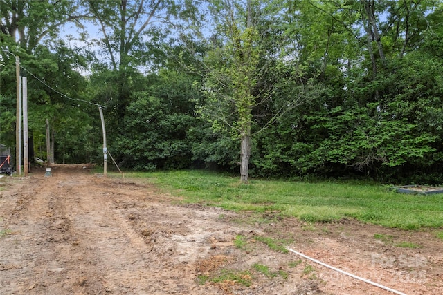 view of yard featuring a view of trees