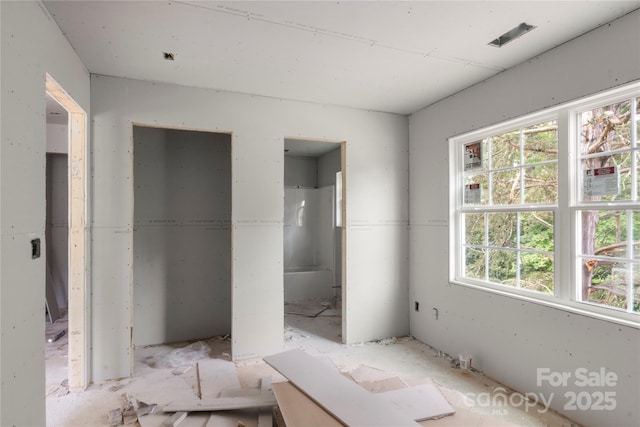 unfurnished bedroom with ensuite bath