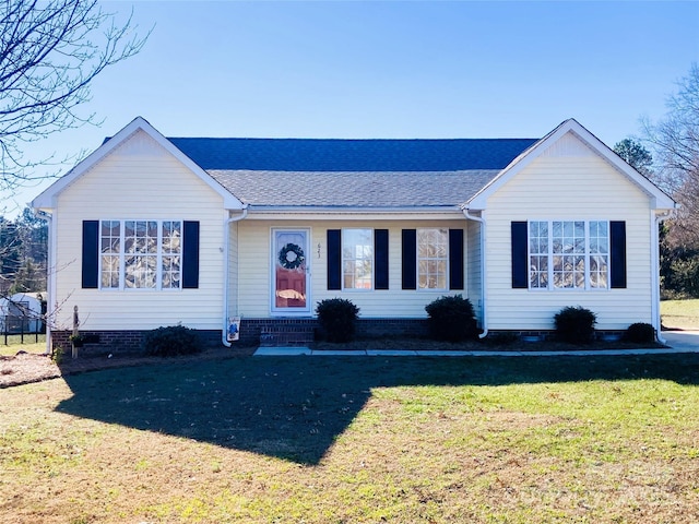 ranch-style house with a front yard