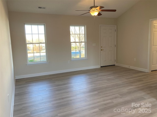 unfurnished room featuring vaulted ceiling, ceiling fan, and light hardwood / wood-style flooring