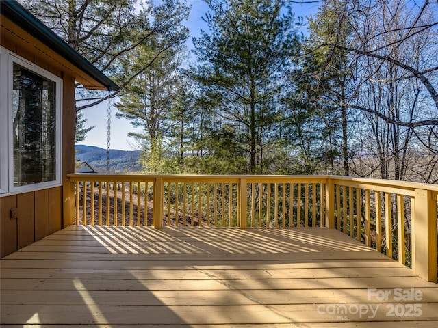 wooden terrace with a mountain view