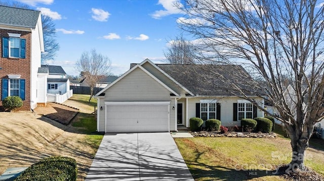 view of front of property with a garage and a front lawn