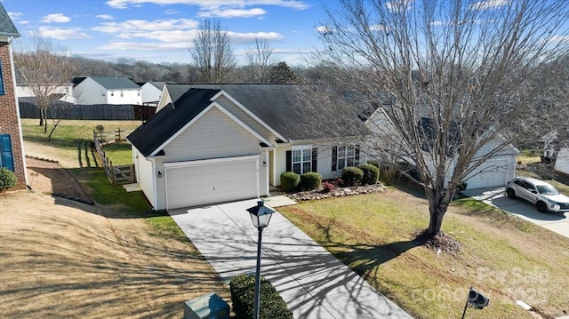 view of front facade featuring a front yard and a garage