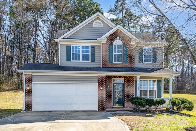 traditional home featuring concrete driveway, brick siding, and an attached garage