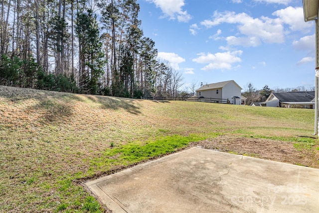 view of yard featuring a patio and fence