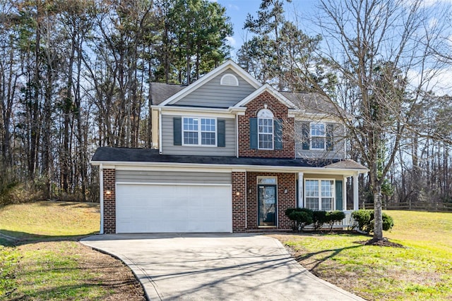 view of front of property with driveway, an attached garage, a front lawn, and brick siding