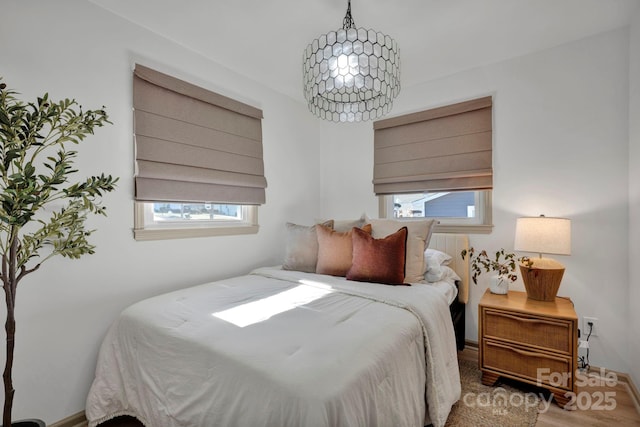 bedroom with a notable chandelier