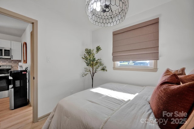 bedroom with light hardwood / wood-style flooring