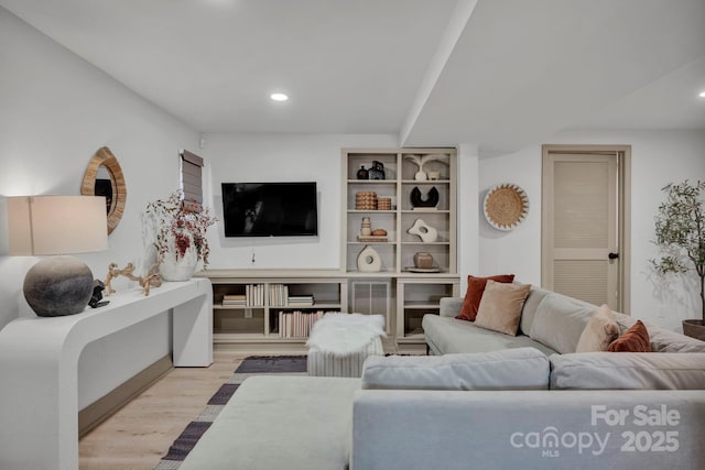 living room with light hardwood / wood-style flooring