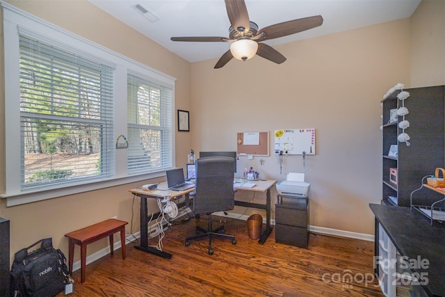 office space with dark hardwood / wood-style floors and ceiling fan