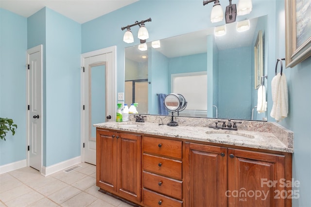 bathroom featuring tile patterned floors and vanity