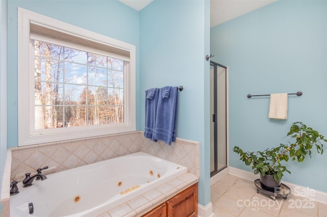 bathroom with separate shower and tub and tile patterned floors