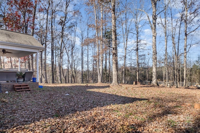 view of yard featuring ceiling fan