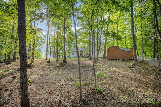 1313 Western Hills Ln, Vale, NC 28168 - view of yard with an outdoor structure, fence, and a shed