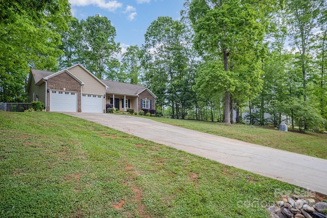 1313 Western Hills Ln, Vale, NC 28168 - ranch-style home with a garage, brick siding, fence, a front lawn, and concrete driveway