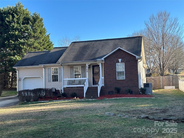 ranch-style house with a front lawn, central AC unit, covered porch, and a garage