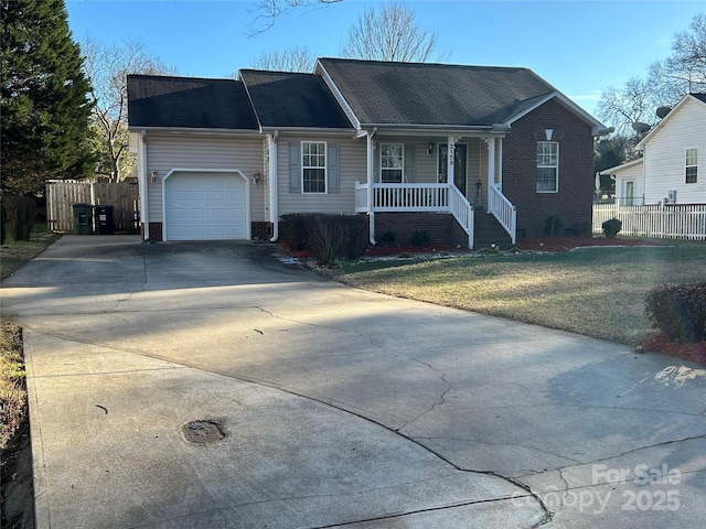 single story home with covered porch, a garage, and a front lawn