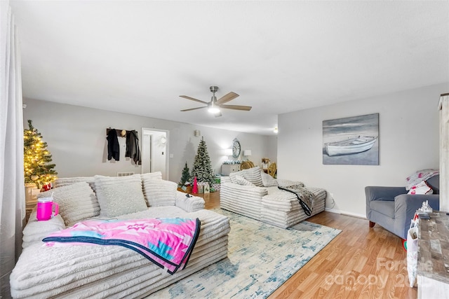 interior space with ceiling fan and hardwood / wood-style floors