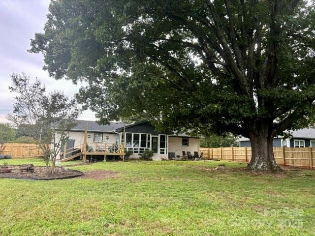 view of yard featuring a wooden deck