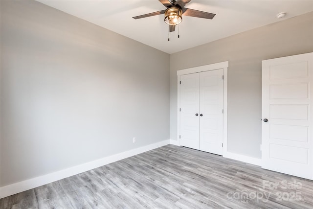 unfurnished bedroom featuring a closet, ceiling fan, and light hardwood / wood-style floors