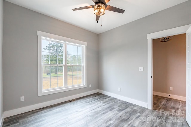 unfurnished room featuring ceiling fan and wood-type flooring