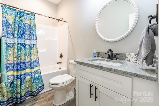 full bathroom with wood-type flooring, vanity, toilet, and shower / bathtub combination with curtain