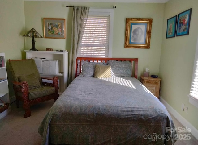 carpeted bedroom with baseboards