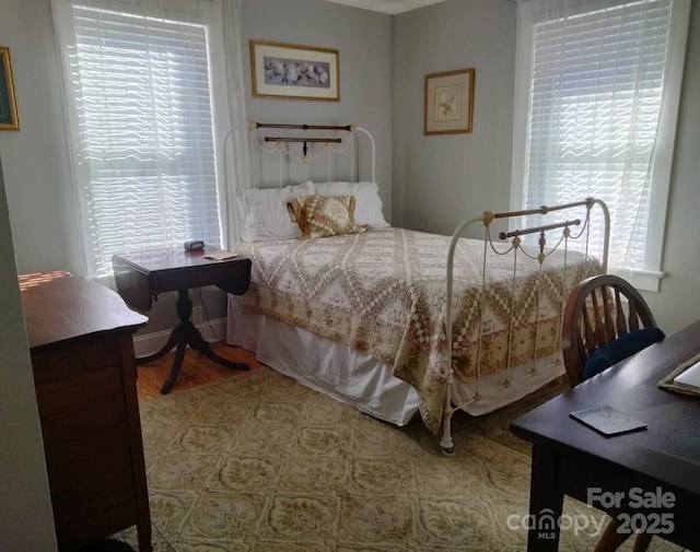 bedroom featuring wood finished floors