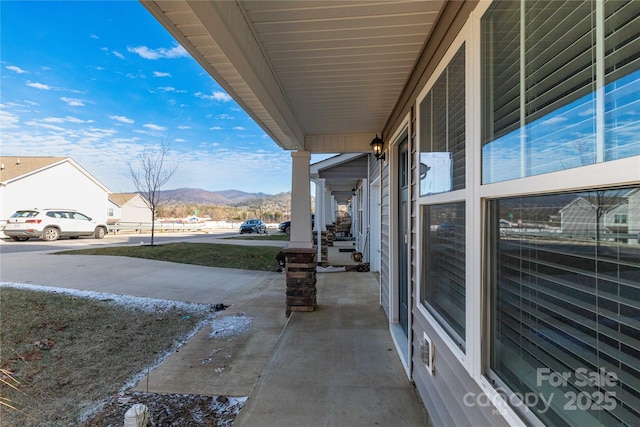 view of patio / terrace featuring a mountain view