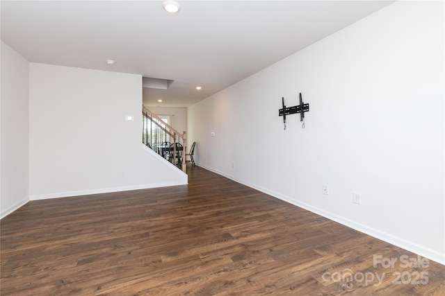 empty room featuring dark hardwood / wood-style flooring