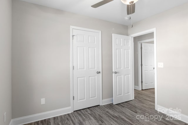 unfurnished bedroom featuring wood-type flooring and ceiling fan