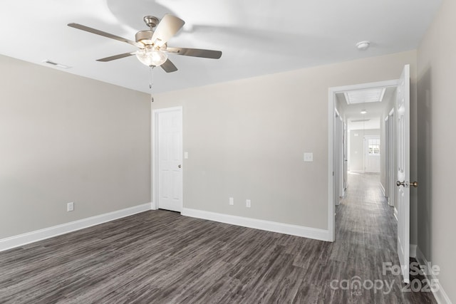 unfurnished room featuring ceiling fan and dark hardwood / wood-style flooring