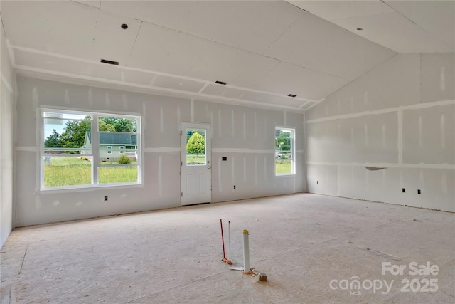 143 Tranquility Ln, Harmony, NC 28634 - unfurnished room with healthy amount of natural light and lofted ceiling