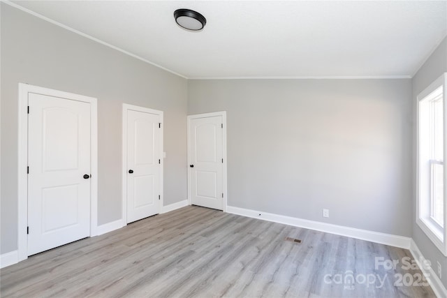 unfurnished room with plenty of natural light and light wood-type flooring