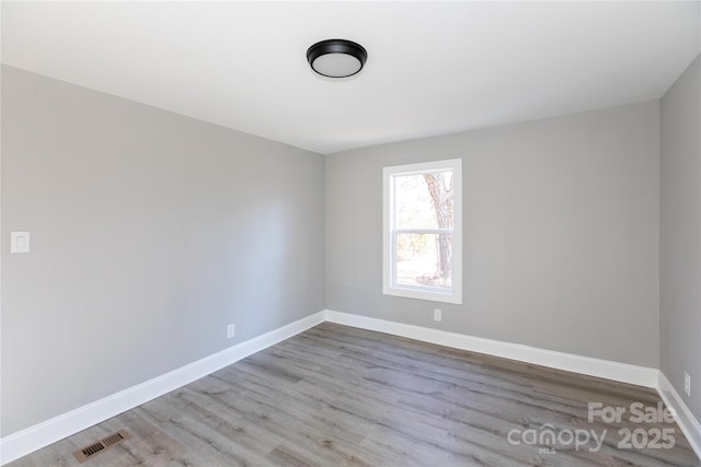 unfurnished room featuring light hardwood / wood-style flooring