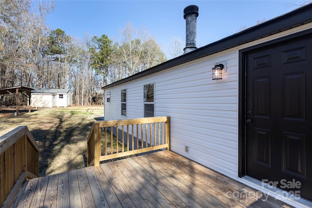 wooden deck with a storage shed