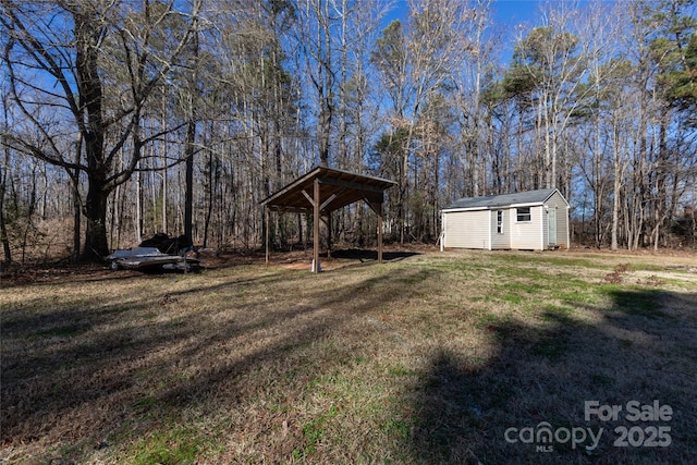 view of yard with a gazebo and a storage shed