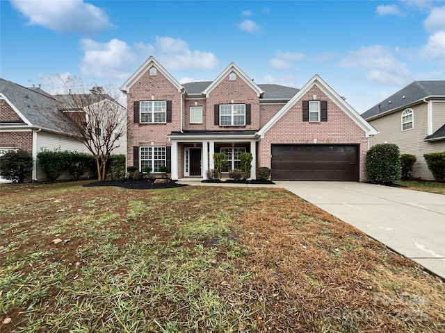 view of front of home with a front lawn and a garage