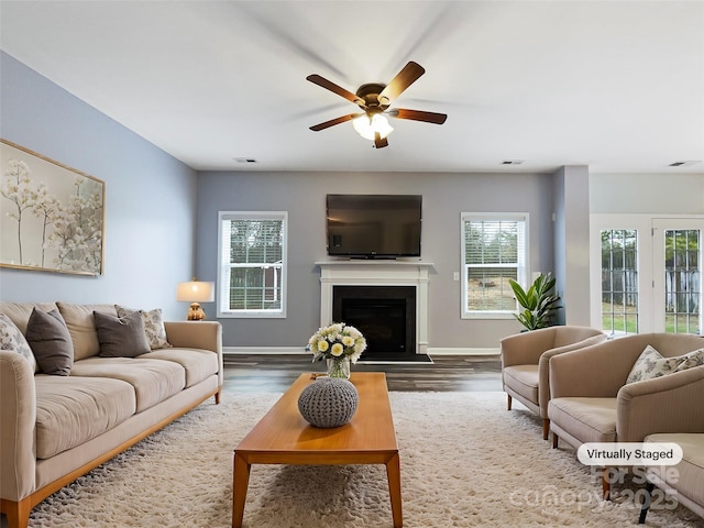 living room with ceiling fan and wood-type flooring