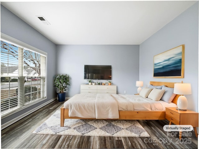 bedroom featuring dark hardwood / wood-style floors