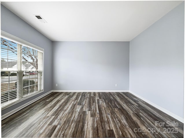 empty room featuring dark hardwood / wood-style floors