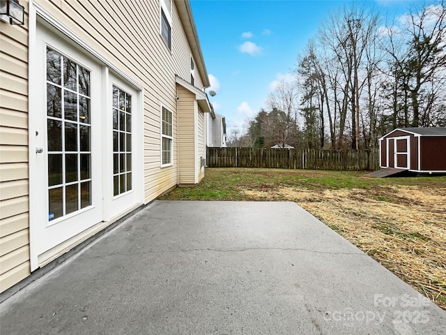 view of patio featuring a storage unit