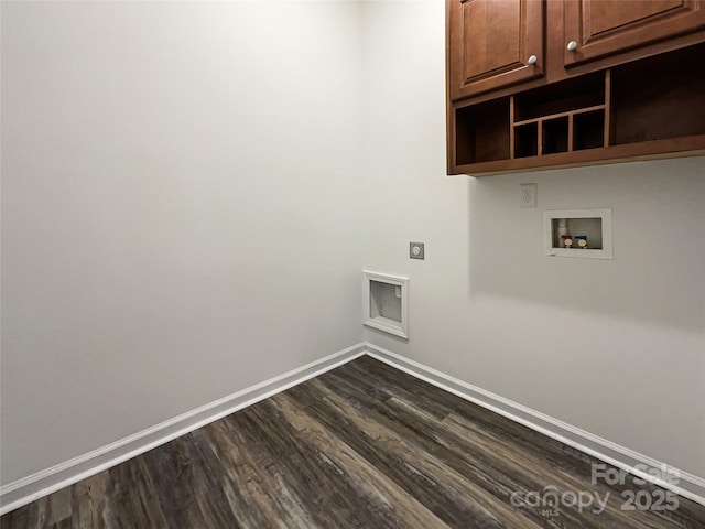 laundry area with dark hardwood / wood-style flooring, cabinets, and washer hookup