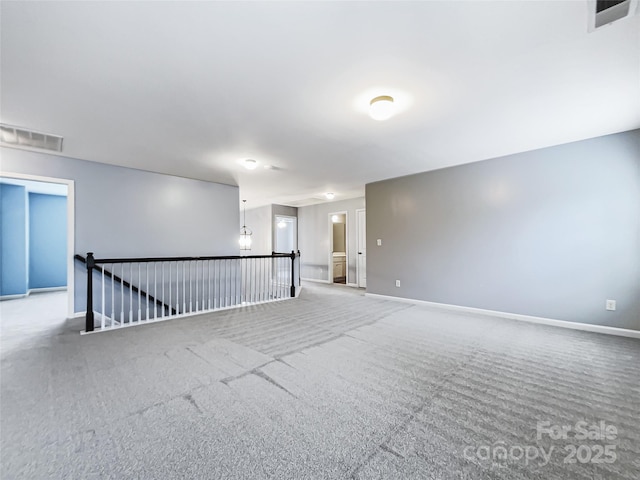 empty room featuring carpet floors