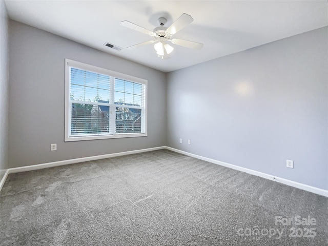 empty room with carpet and ceiling fan