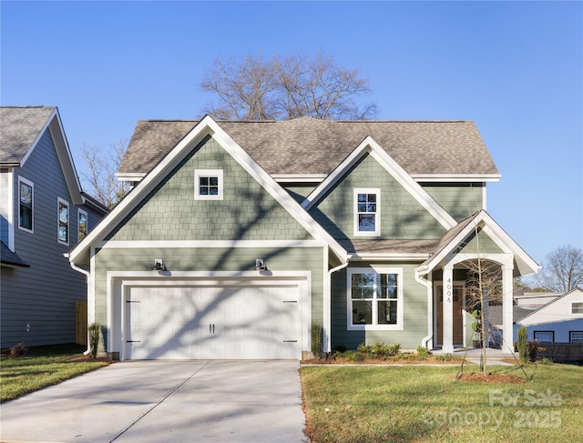 craftsman-style home with a garage and a front yard