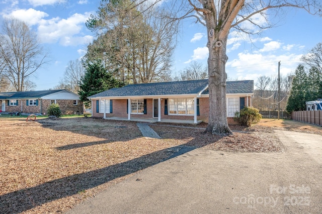 ranch-style home with a porch